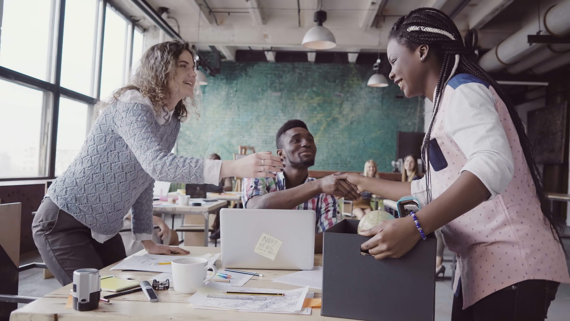 Young african woman recently hired for corporate job comes into new office